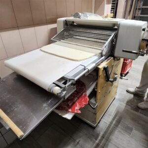 Using the pastry sheeter takes practice, but it turns dough into perfect, even layers
